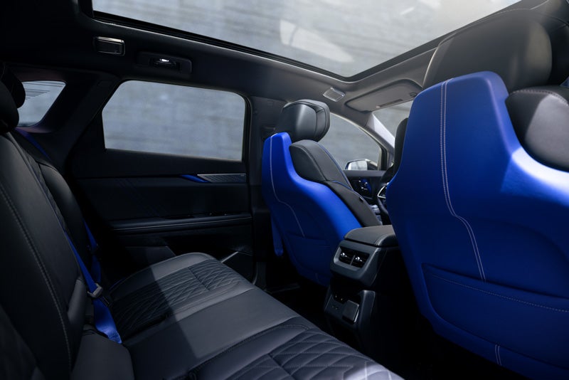 Back Seat View of the 2026 OPTIQ-V Blue Front Seats, Sun Roof, and Interior | Sheehan Cadillac in Pompano Beach FL