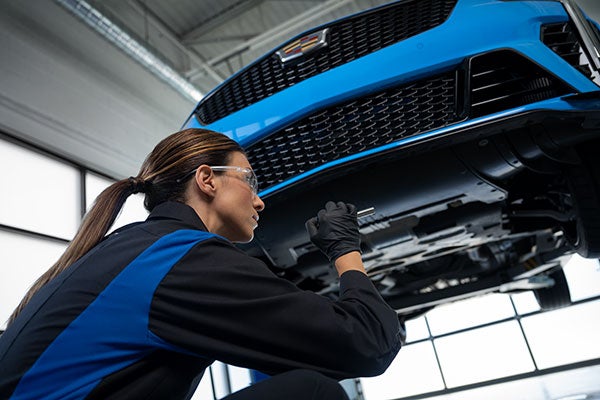Service Center at Sheehan Cadillac in Pompano Beach FL - Employee working on Cadillac vehicle