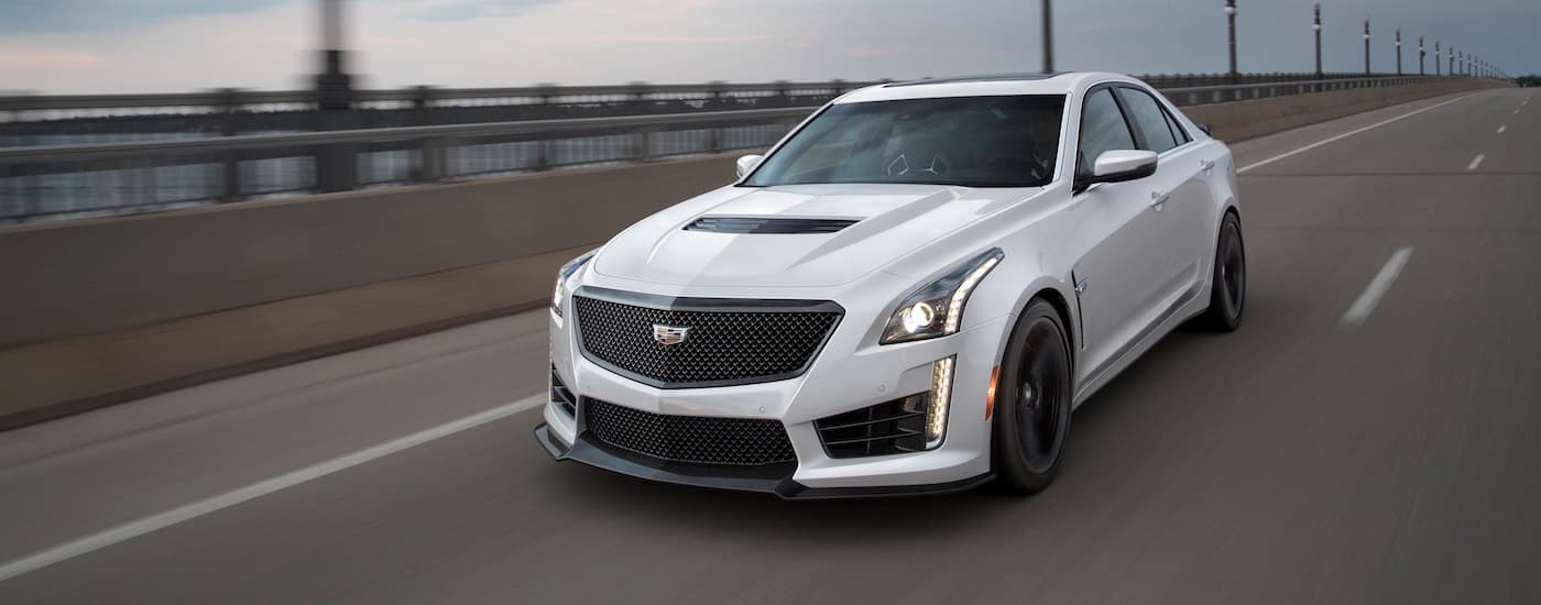 White 2018 Cadillac CTS-V driving down a freeway