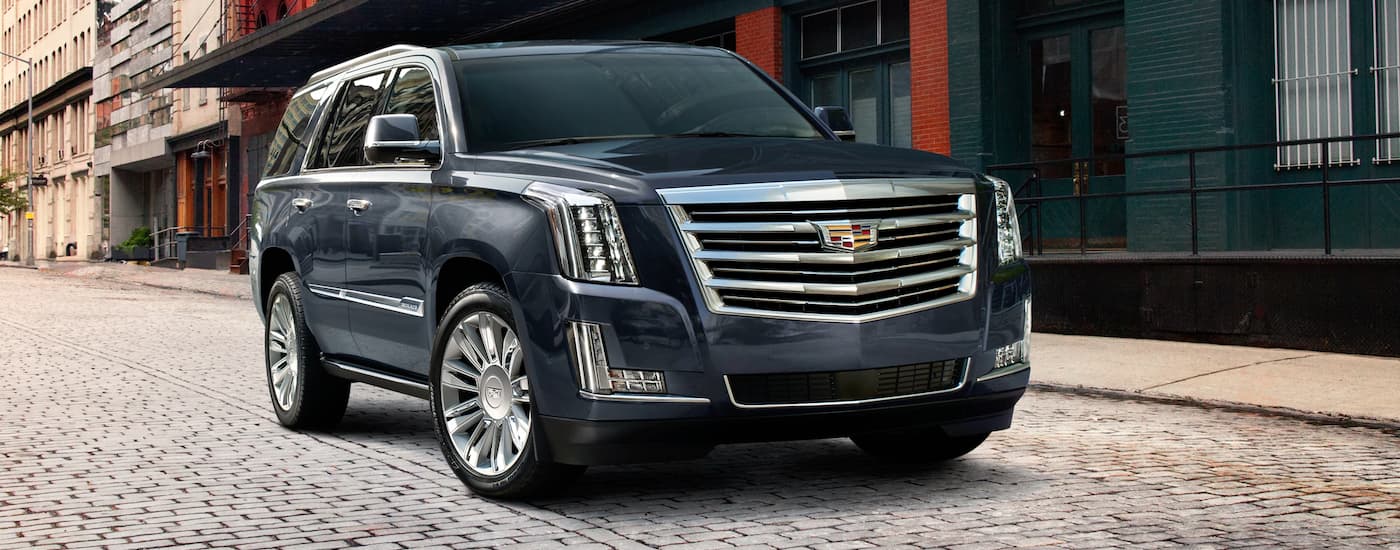 Black 2020 Cadillac Escalade parked on a cobblestone street