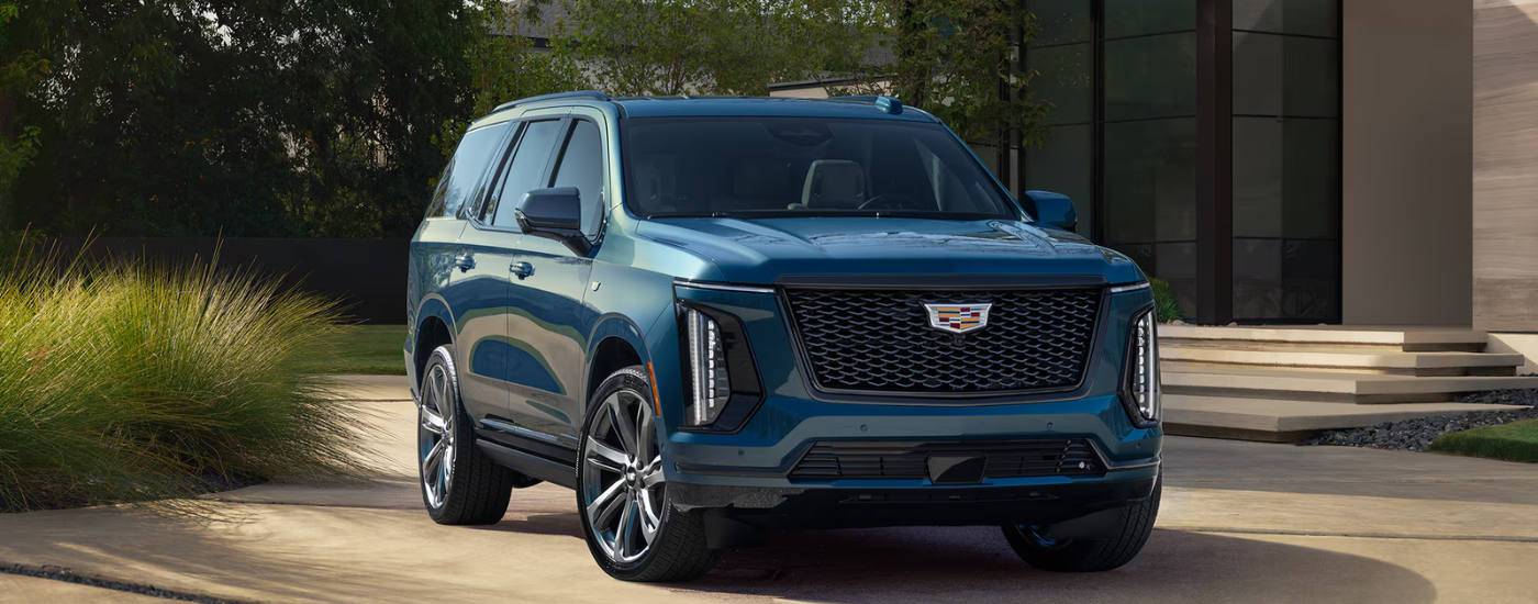 Blue 2026 Cadillac Escalade parked in a driveway
