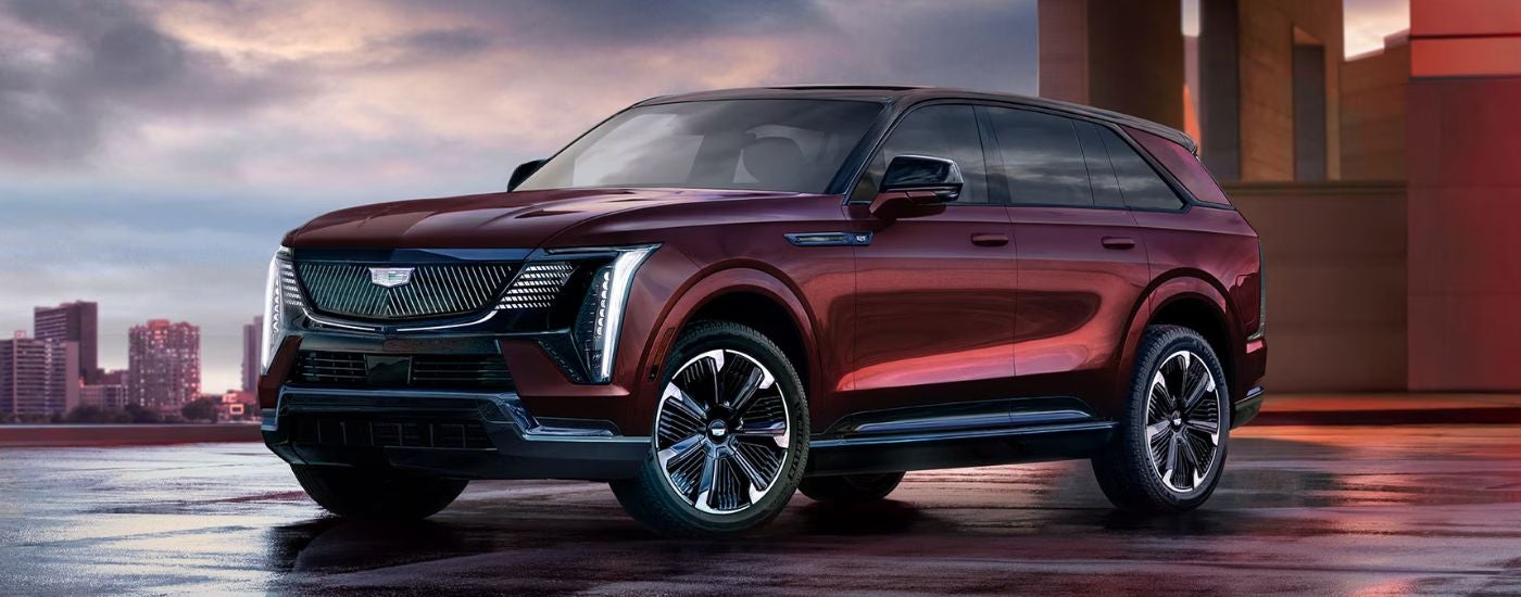 Red 2026 Cadillac Escalade IQ parked in a city