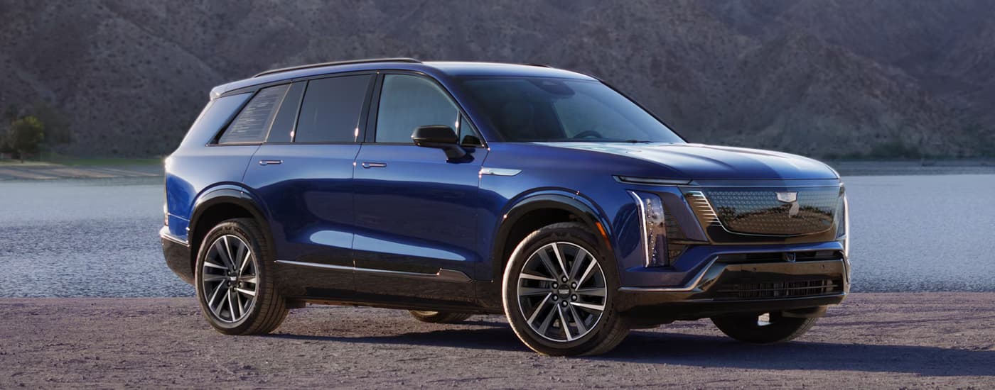 Blue 2026 Cadillac VISTIQ parked overlooking a lake
